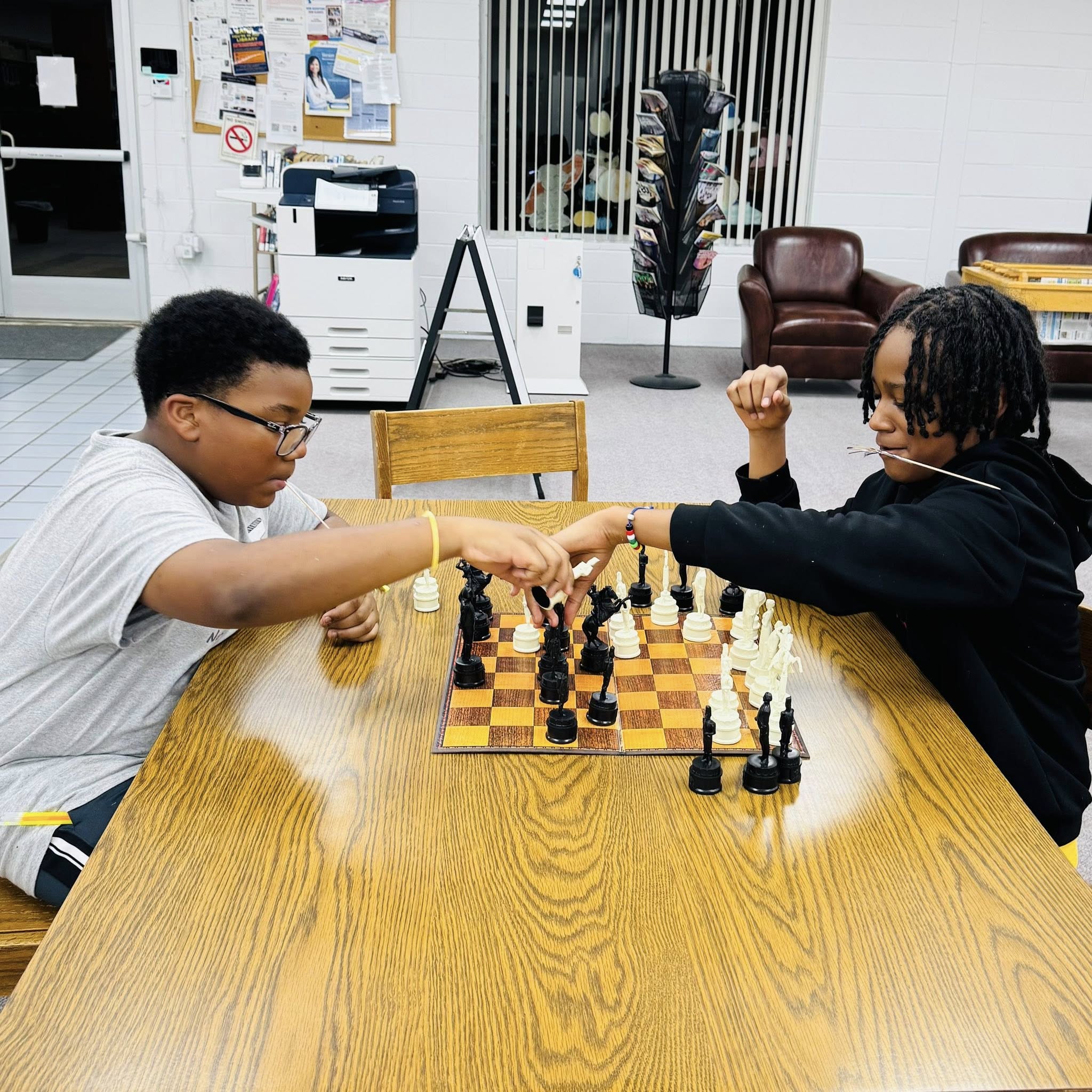 Two kids playing chess.